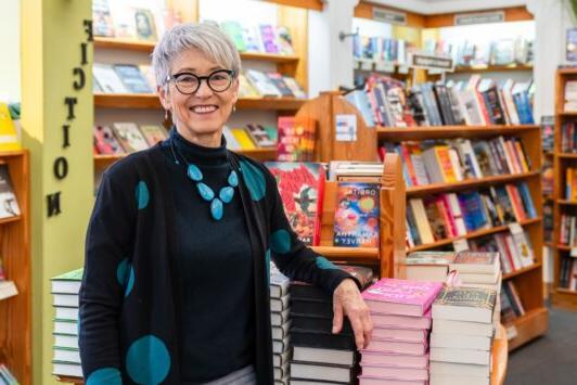 Kris Kleindienst poses in her legendary bookstore, 左岸账簿.